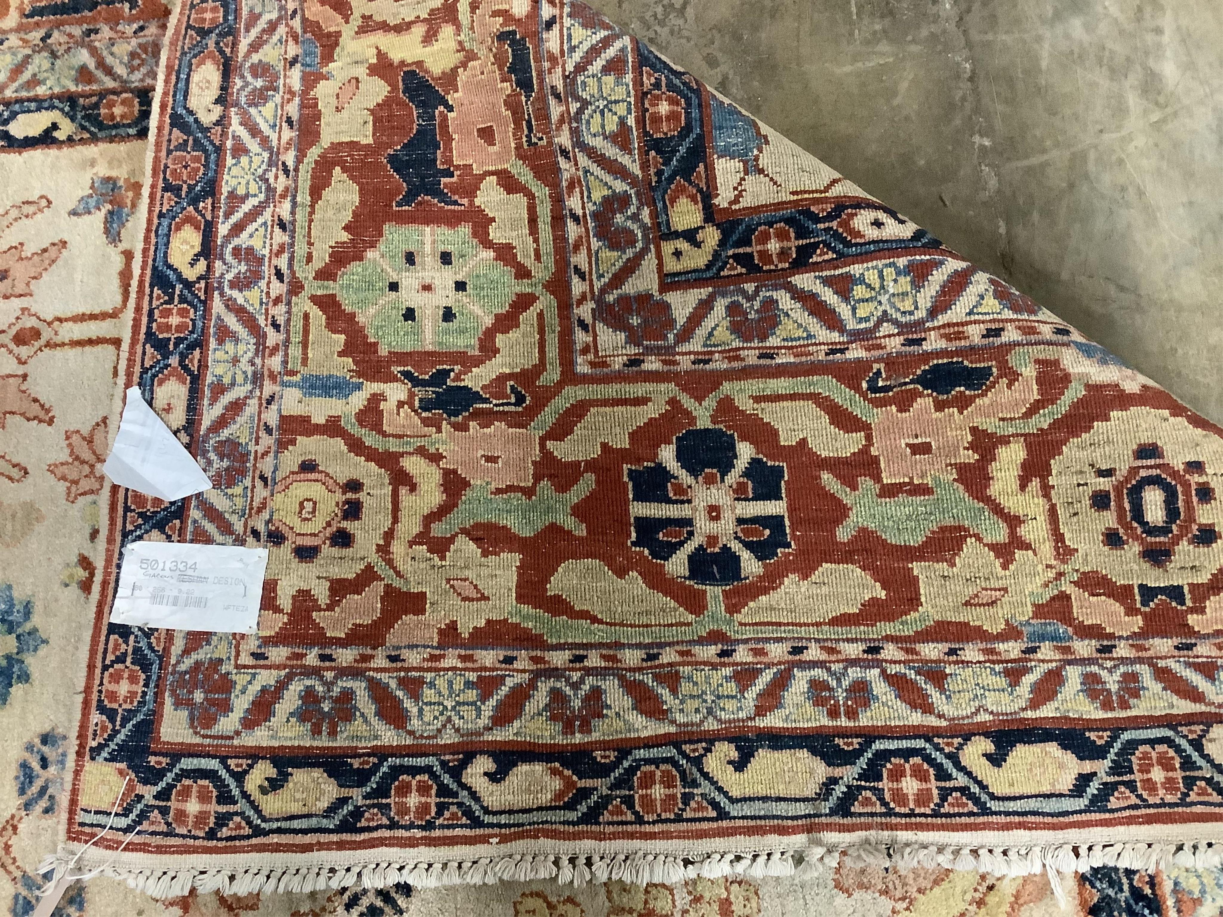 A Garous Zeigler style ivory ground carpet, 358 x 260cm. Condition - fair, one stained patch